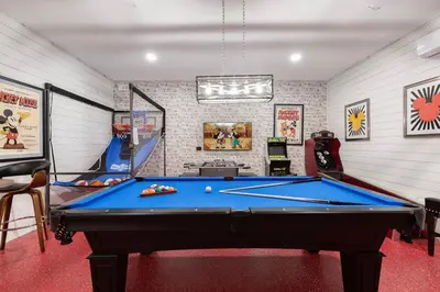 a billiard room with a pool table in it at Unleash Your Dreams in a Magical Getaway in Orlando