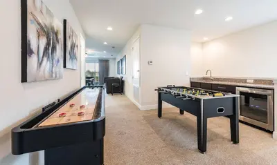 a room with a pool table and a game table at Dive into Luxury and Fun at Your Orlando Paradise in Orlando