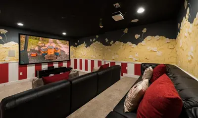 a living room with a couch and a flat screen tv at Dive into Luxury and Fun at Your Orlando Paradise in Orlando