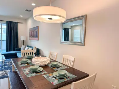 a dining room with a table and chairs at TR1399 – 4BR - 8 guests in Orlando