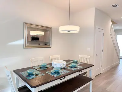 a dining room with a table and chairs at TR1399 – 4BR - 8 guests in Orlando