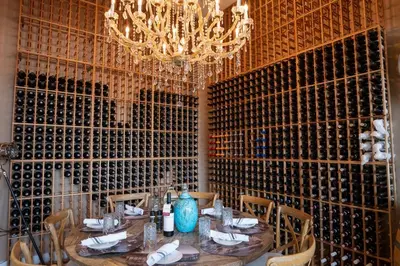 a dining room with a table and a chandelier at Disney Escape Modern 3BR Townhouse 2 Miles to the Parks 4 Baths in Orlando
