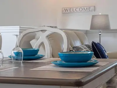 a table with two blue bowls on top of it at Oakwater Resort Home w/ Arcade & Pool Table - 15 Min to Disney in Orlando