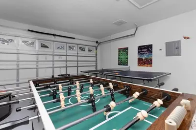 a room with a pool table and ping pong balls at Indian Ridge Home w/ Private Pool & Game Room near Disney in Orlando