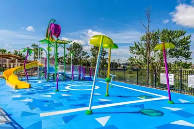 a water park with a slide and a playground at 3 Mi to Disney Family-Friendly Home! in Orlando