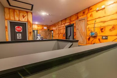 a bar in a room with wooden walls at Disney Dream House com 12 Themed Bedrooms 5851 in Orlando