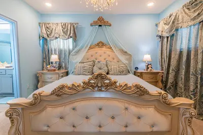 a bedroom with a large bed with a canopy at Disney Dream House com 12 Themed Bedrooms 5851 in Orlando
