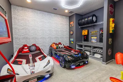 a bedroom with a race car bed and a lego garage at Disney Dream House com 12 Themed Bedrooms 5851 in Orlando