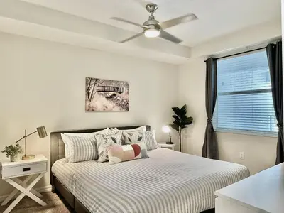a bedroom with a bed and a ceiling fan at My condo 2bd 2bth close to Disney World 315 in Kissimmee