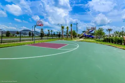 a basketball court in a park with a basketball hoop at My condo 2bd 2bth close to Disney World 315 in Kissimmee