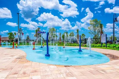 a playground with water fountains in a park at My condo 2bd 2bth close to Disney World 315 in Kissimmee