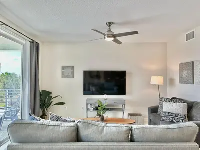 a living room with a couch and a ceiling fan at My condo 2bd 2bth close to Disney World 315 in Kissimmee