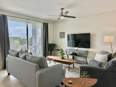 a living room with two couches and a tv at My condo 2bd 2bth close to Disney World 315 in Kissimmee