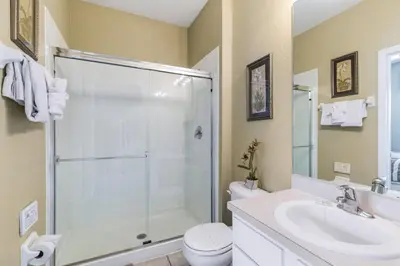 a bathroom with a shower and a toilet and a sink at Escape to Luxury in Orlando Villa6492 in Orlando