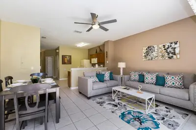 a living room with a couch and a table at Escape to Luxury in Orlando Villa6492 in Orlando