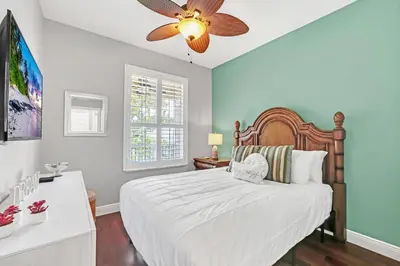 a bedroom with a bed and a ceiling fan at Serene 3 Bedroom Retreat in Orlando6494 in Orlando