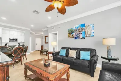 a living room with a couch and a table at Serene 3 Bedroom Retreat in Orlando6494 in Orlando