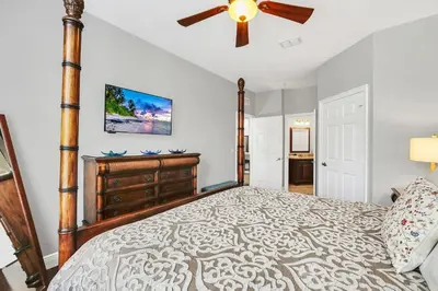 a bedroom with a bed and a ceiling fan at Serene 3 Bedroom Retreat in Orlando6494 in Orlando