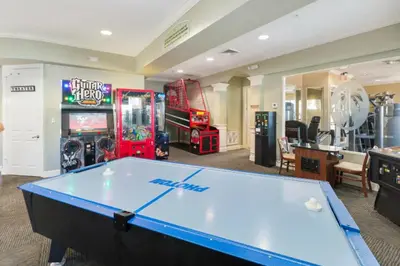 a pool table in a room with arcade games at Serene 3 Bedroom Retreat in Orlando6494 in Orlando