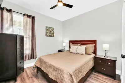a bedroom with a bed and a ceiling fan at Dreamy 6 Bedroom Villa in Orlando6495 in Orlando