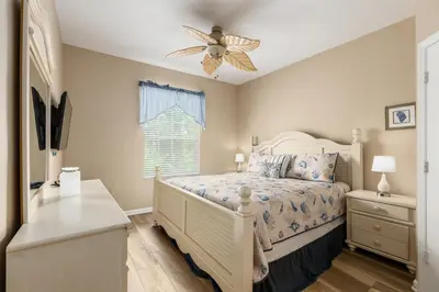 a bedroom with a bed and a ceiling fan at Stunning 2 Bedroom Retreat in Orlando6496 in Orlando