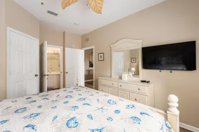a bedroom with a bed and a tv on the wall at Stunning 2 Bedroom Retreat in Orlando6496 in Orlando