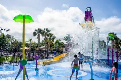 a group of children playing in a water park at Cozy 3 Bedroom Haven in Orlando6497 in Orlando