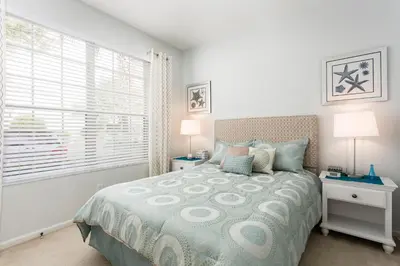 a bedroom with a bed and a window at Cozy 3 Bedroom Haven in Orlando6497 in Orlando