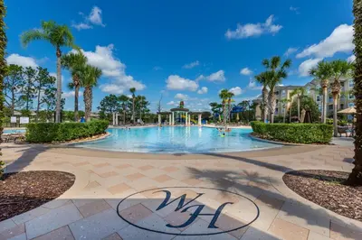 a swimming pool at a resort with palm trees at Charming Orlando Villa with 5 Bedrooms6499 in Orlando
