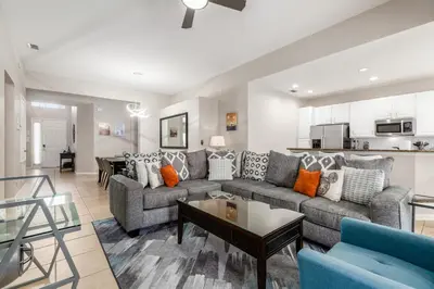a living room with a couch and a table at Charming Orlando Villa with 5 Bedrooms6499 in Orlando