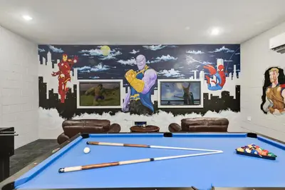 a room with a pool table and a mural at Orlando Dream Home - 4 Bed Villa6501 in Orlando
