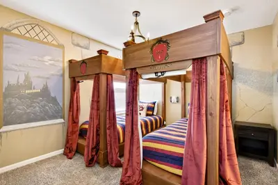a bedroom with a bed with a canopy at Orlando Oasis: 5 Bedroom Villa6502 in Orlando