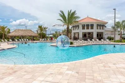 a pool at a resort with a ball in the middle at Luxury 2bd 2 bath Condo Home 250 in Kissimmee