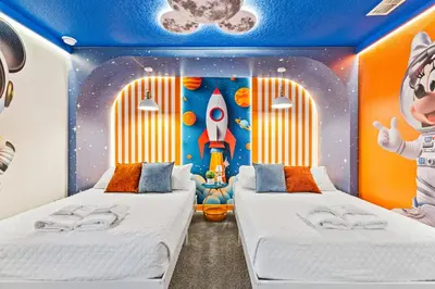 a bedroom with two beds in a rocket themed room at 2869 Epic Themed Mega Home at Storey Lake 7DB in Kissimmee
