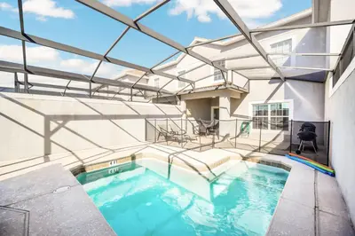 an indoor swimming pool with a glass ceiling at Heated pool Lazy River Mini Golf Near Disney Resort in Kissimmee