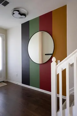 a room with a mirror on a colorful wall at Magical Getaway Close to Disney with Heated Pool in Orlando