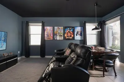 a living room with a leather couch and a table at New Listing - Be the First Guest 5 BR - BV468 in Kissimmee