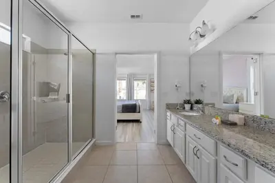 a bathroom with a walk in shower and a sink at New Listing - Be the First Guest 5 BR - BV468 in Kissimmee