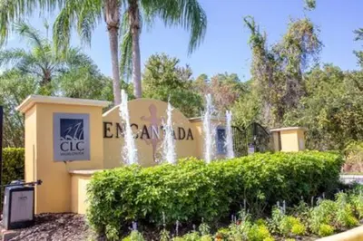 a sign for the entrance to a park with a fountain at Cozy 3 BR wprivate pool in Kissimmee
