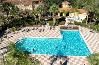an overhead view of a swimming pool in a resort at Cozy 3 BR wprivate pool in Kissimmee