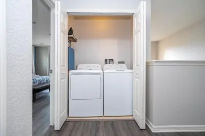 a laundry room with a washer and dryer at Cozy 4BR Regal Oaks close to Disney in Orlando