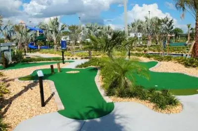 a golf course with a putting green in a resort at Storey Lake Resort 5BD Private Pool Close to Disne in Kissimmee