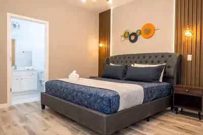 a bedroom with a large bed in a room at Stunning 15 suites close to Disney in Kissimmee