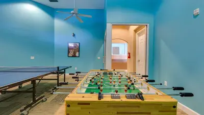 a room with a pool table and a ping pong ball at 3-Bedroom Villa in Bella Vida Resort, Close2Disney in Kissimmee