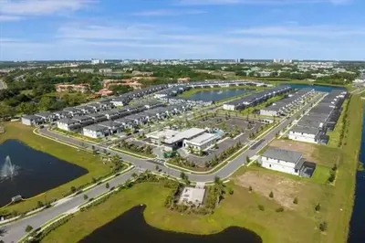 an aerial view of a parking lot next to a harbor at Luxurious 15BR Villa with Lake View & Game/Theater in Orlando