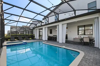 an indoor swimming pool with a glass ceiling at Epic Family Getaway: Themed Villa Near Disney ! in Kissimmee