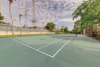 a tennis court with a tennis racket on it at Cozy Lakeview Getaway Near Universal Studios 2602 in Orlando