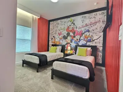 a bedroom with two beds and a mural on the wall at 5BR c/Piscina Privada | Luxo em Storey Lake in Kissimmee