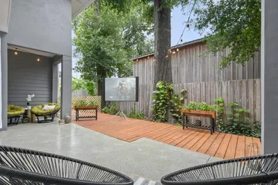 a patio with two chairs and a projection screen at Great Outdoor Area in Orlando