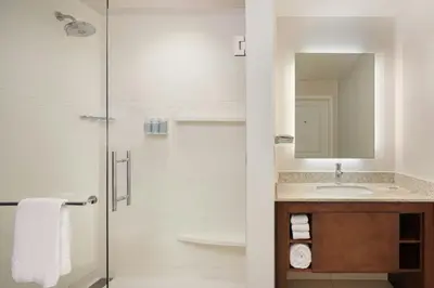 a bathroom with a sink and a shower at Residence Inn by Marriott Orlando Downtown in Orlando